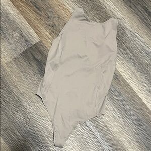 (25) Aritzia TNA action Bodysuit